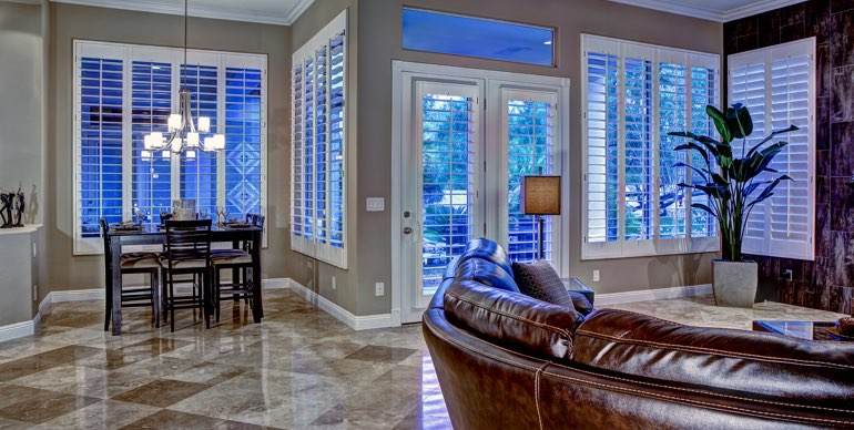 Cincinnati great room with white shutters and leather furniture.